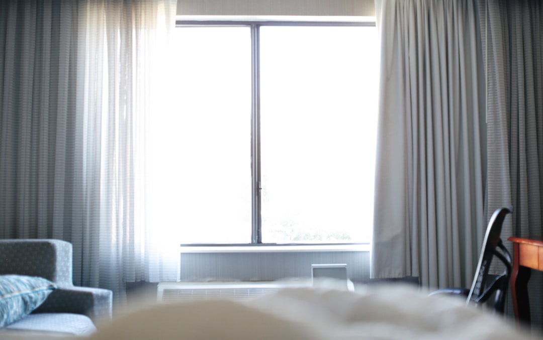 white-bed-near-white-window-curtain-gszclvkr4ok