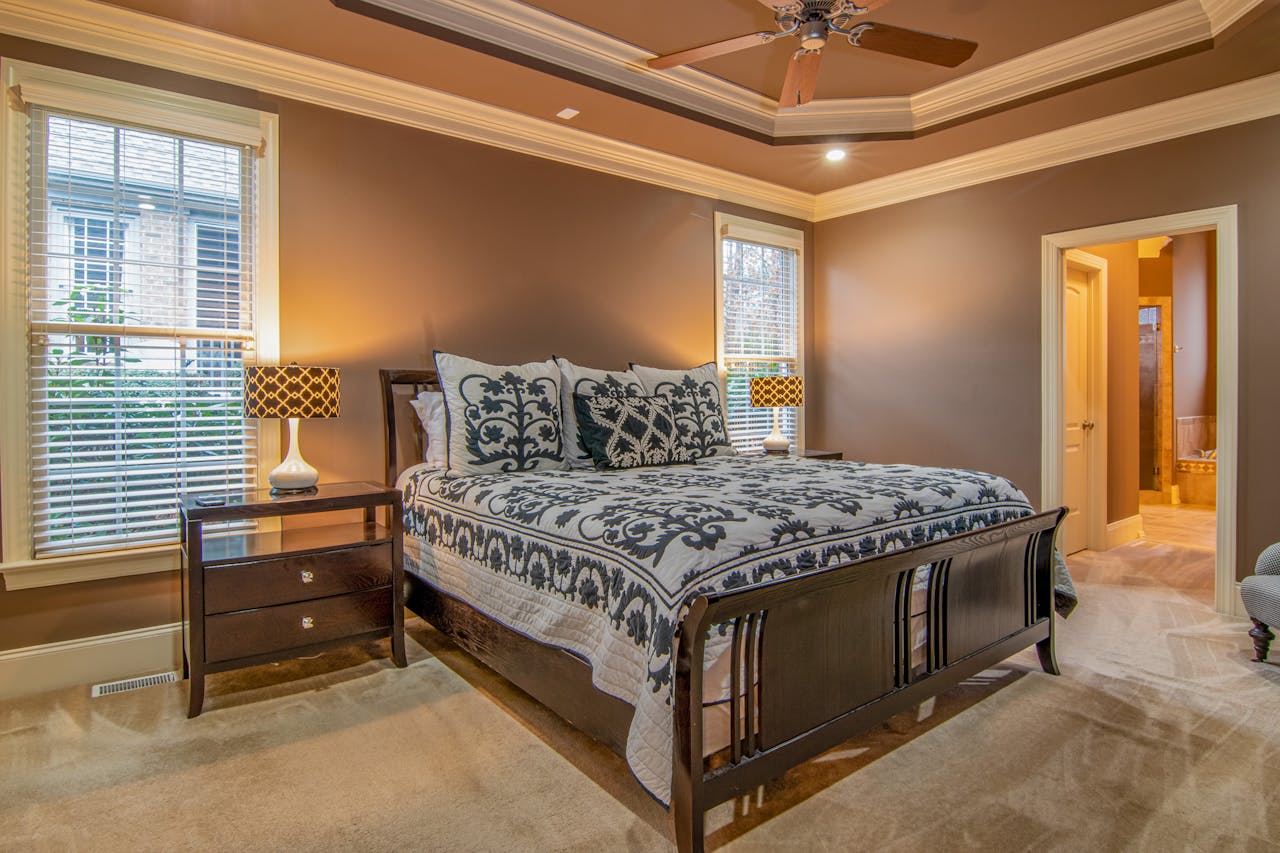 Warm and inviting modern bedroom featuring elegant decor and natural lighting.